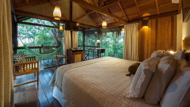 Luxury Anavilhanas Lodge bungalow bedroom / Photo by Marcelo Isola