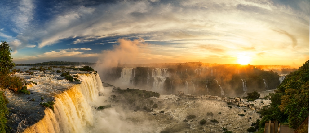 Sun setting behind waterfalls